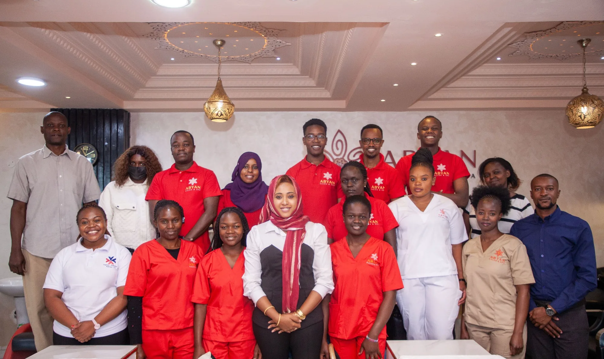 Salons Assured Kenya working with a salon owner and professional beauty team