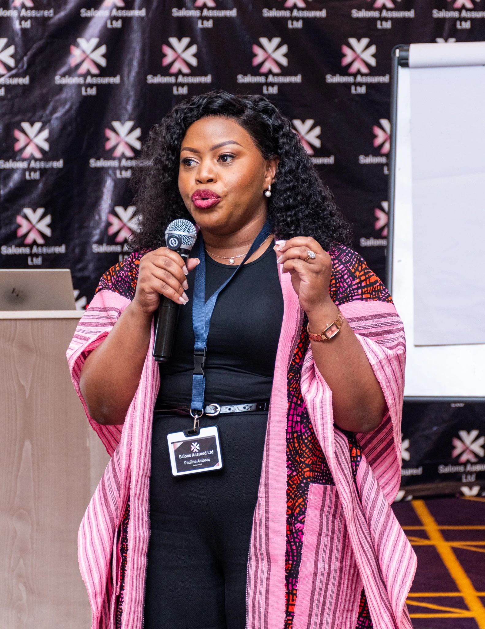 Salons Assured leadership representative at a professional industry event